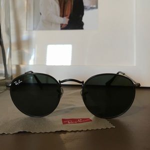 Black on black round raybans